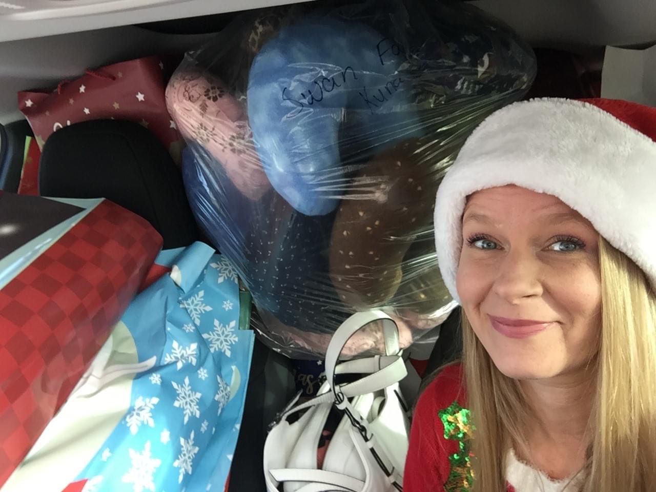 Volunteer with a vehicle fully stuffed with donations